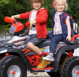 Children riding on a Duplay electric ride-on car