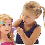 Girl with Toys R Us Styling Head toy